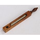 Dr. Forbes wooden cased thermometer, with turned handle above the pierced square central section