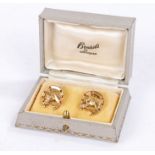 Pair of gold coloured metal cufflinks, the terminals depicting a horseshoe with central horses head,
