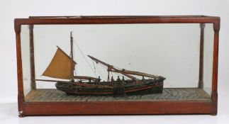 Victorian model of a Yarmouth Drifter, YH. 179, with folding main mast and figures on deck lifting a