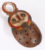 Ivory Coast Baule mask, having horns above a polychrome face with a rectangular carved mouth, the