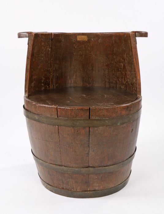 H.M.S. Ganges barrel chair, with embossed copper plate to the back and with banding to the exterior,