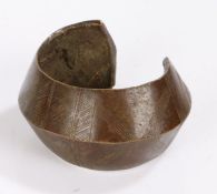 Nigerian bronze bangle, with incised decorations, 8.5cm wide