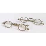 Two 19th Century silver spectacles with extending arms, mounted with lenses (2)