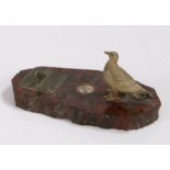 Early 20th Century desk ornament, with cold painted bronze seagull, compass and sundial, on a red