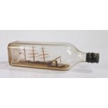 Ships in a bottle, depicting a three master British sailing vessel and a tug boat, 27cm wide