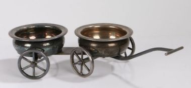 Silver plated novelty wine coaster trolley, the two coasters mounted to a four wheeled trolley