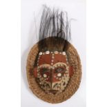 Papua New Guinea turtle shell mask, Sepik River region, the polychrome face inlaid with shells, with