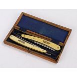 Pair of Gotta cut throat razors, housed in a blue velvet lined wooden box