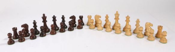 Carved and weighted wooden chess set, the king 9.5cm high