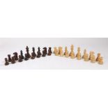 Carved and weighted wooden chess set, the king 9.5cm high