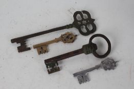 Four various eastern keys, the largest 29cm long (4)