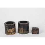 Pair of small Chinese wooden pots, each with gilded pagoda's and figures on a black lacquered