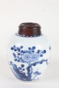 Chinese porcelain ginger jar, with blue blossoming flowers and branches on a white ground, with