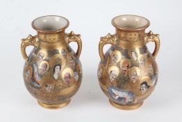 Pair of Japanese Satsuma vases, 20th century, each of baluster form with carrying handles and