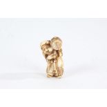Japanese Meiji period carved ivory netsuke, modelled as a standing figure, 4.5cm high