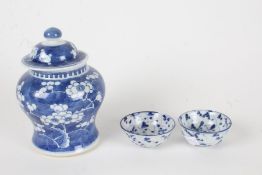 Chinese hawthorn vase and cover, 20th Century, in blue and white, 17cm high, together with two