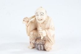 Japanese Meiji period carved ivory netsuke, in the form of street vendor holding fish, character