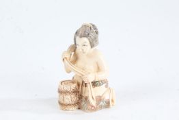 Japanese Meiji period carved ivory netsuke, in the form of a kneeling woman, with coloured