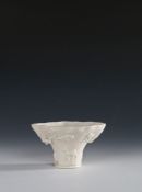 Chinese Blanc de chine porcelain libation cup, Kangxi, the wide top with branches and animals around