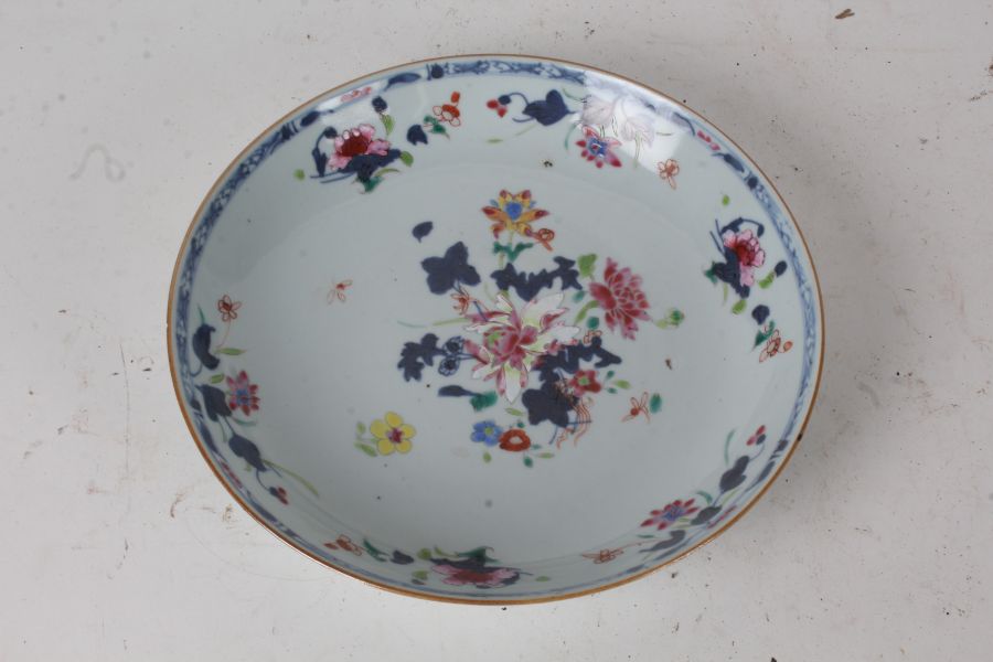 18th century Chinese porcelain plate, with polychrome flowers on a white ground within a blue