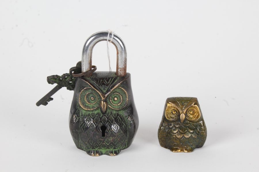 Novelty cast metal padlock in the form of an owl, 12cm high, together with a similar ornament, 5cm