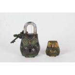 Novelty cast metal padlock in the form of an owl, 12cm high, together with a similar ornament, 5cm