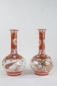 Pair of Japanese Kutani porcelain vases, early 20th century, each having long slender necks and