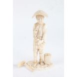 Japanese carved ivory okimono, Meiji period, in the form of a man holding various tools (AF), 21cm