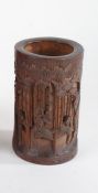 Chinese bamboo brush pot, with carved depictions of figures amongst foliage and bamboo, 13.5cm high