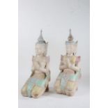 Pair of Thepphanom carved wooden and painted figures, each modelled in a kneeling position