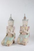 Pair of Thepphanom carved wooden and painted figures, each modelled in a kneeling position