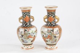 Pair of Japanese satsuma vases depicting figures and landscape scenes,15.5cm tall