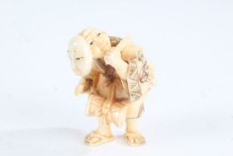 Japanese Meiji period carved ivory netsuke, in the form of a street entertainer, with character