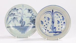 Two Chinese Qing Dynasty dishes, decorated to the centre with a tree and flowers to the sides,