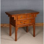 Chinese elm table, 20th century, the rectangular top above short and one long drawer, raised on