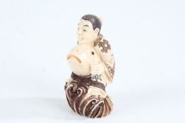Japanese Meiji period carved ivory netsuke, in the form of a man with fish, having coloured