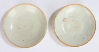 Two Chinese Qingbai ware shallow dishes, Song Dynasty (960-1279) pale cream glaze with unglazed