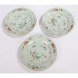 Three 18th Century Chinese porcelain plates, each painted with flowers on a white ground, (one