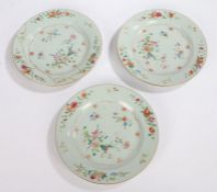 Three 18th Century Chinese porcelain plates, each painted with flowers on a white ground, (one