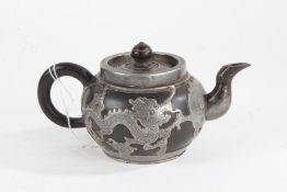 Chinese white metal mounted pottery teapot, of squat baluster form, overlaid with a dragon each side
