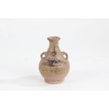 Small pottery baluster vase, probably Chinese, with flared neck, handle either side and baluster