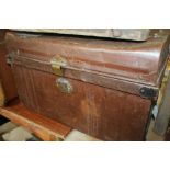 Two tin trunks, the smaller trunk with wood effect finish, 55cm and 60cm wide (2)