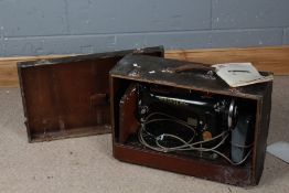 Singer sewing machine, housed within a carrying case