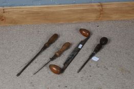 Four various wooden and metal tools, to include two screwdrivers (4)