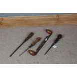 Four various wooden and metal tools, to include two screwdrivers (4)