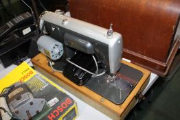 Cased Acadex sewing machine
