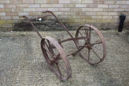 Cast iron and wooden handled two wheeled barrow