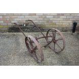 Cast iron and wooden handled two wheeled barrow