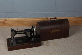 Hexagon hand sewing machine, by Albert List of Ipswich, housed within a carrying case