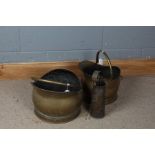 Two brass coal scuttles, together with a WW2 brass shell case dated 1941 and a pair of fire tongs (